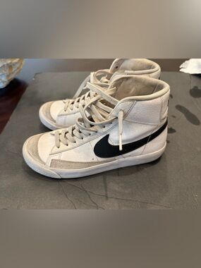 Nike White High-Top Sneakers with Black Swoosh